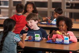 Photo of students eating a meal Photo of students eating a meal