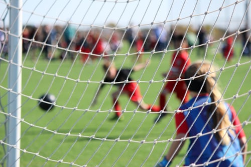 Students playing soccer